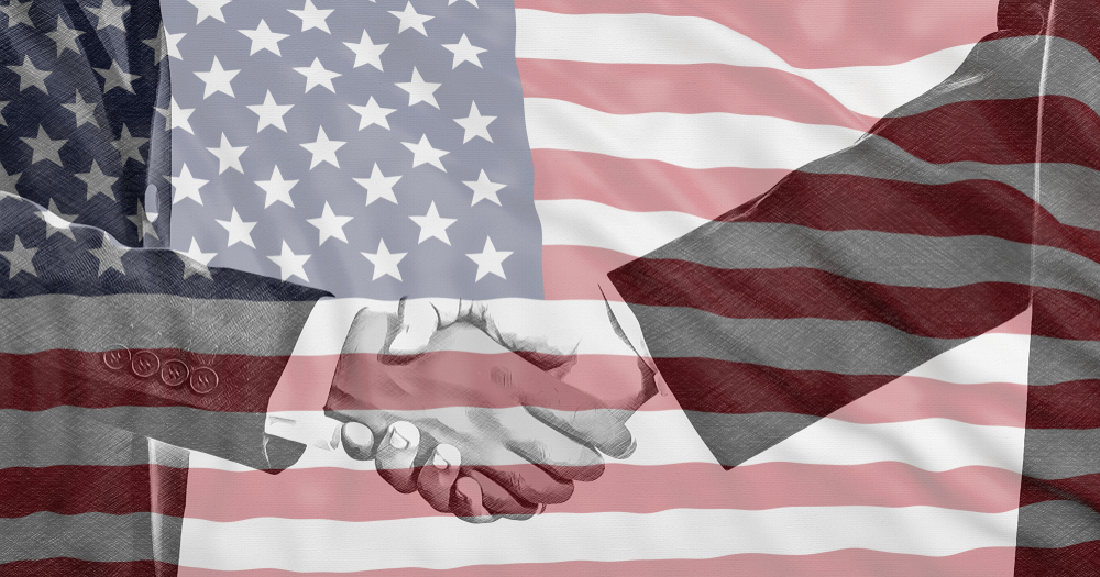 Black and white handshake on US flag background, agreement concept